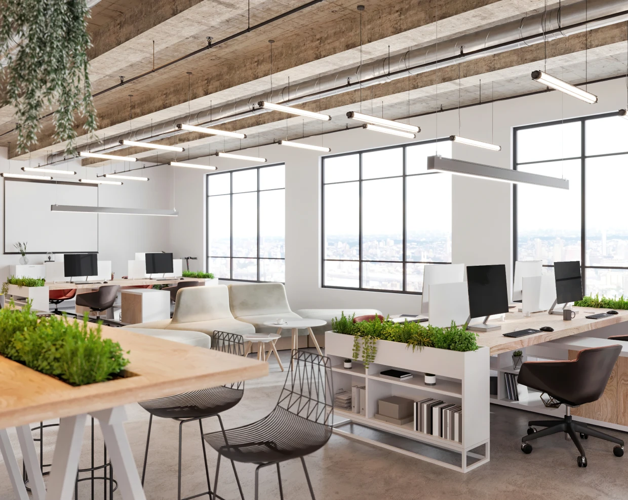 Modern open-plan office with greenery.
