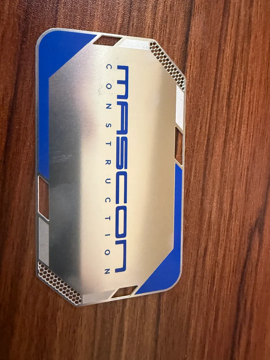 Metallic card with "Mascon Construction" logo.